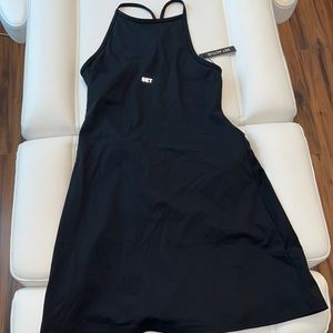 Black Exercise Dress New with Tags. Open Back